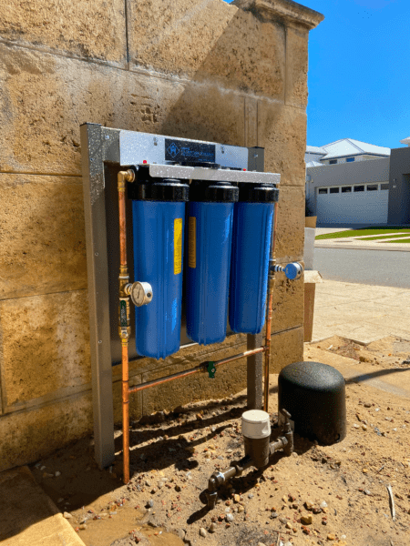An Entire Home Filtration System mounted on a brick wall
