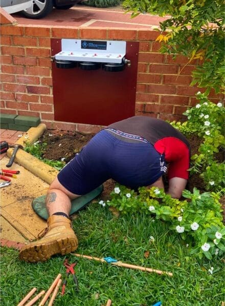 Home Filtration Stystem being installed on a brickwall by plumber